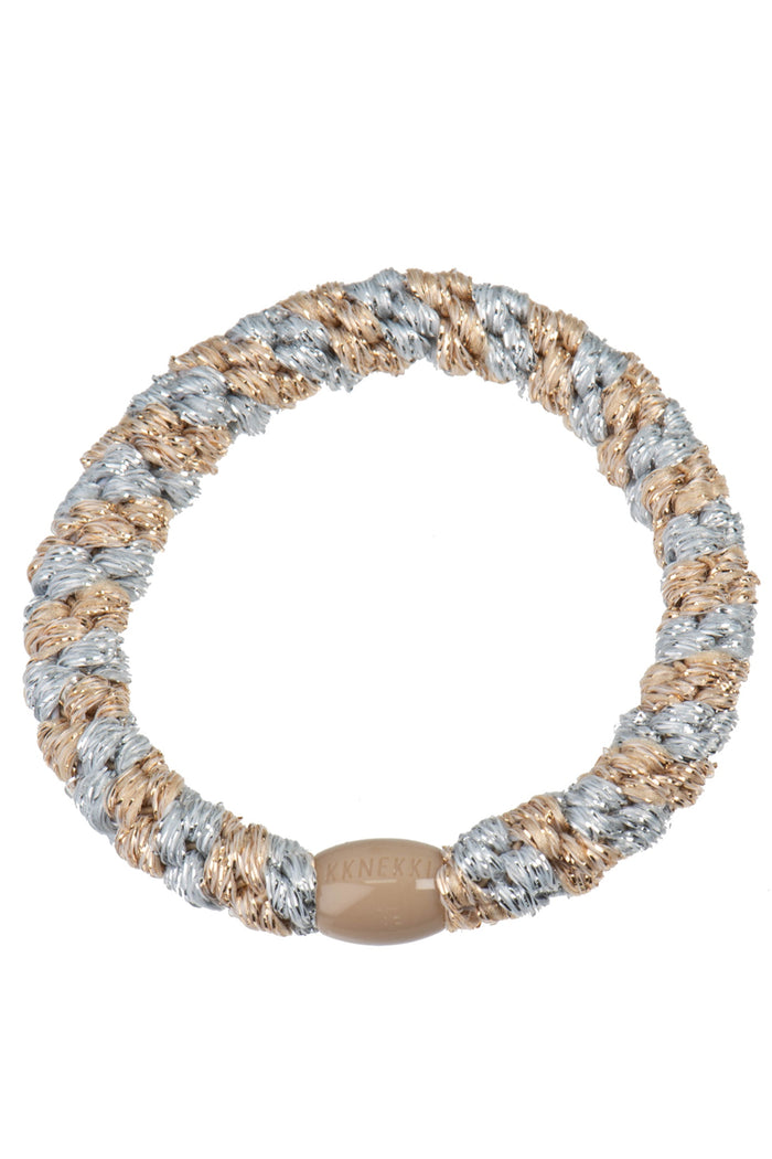 KKNEKKI Silver-Beige glitter stripe elastic hair tie with twisted silver and beige glitter fibers and a beige branded clasp by KKNEKKI. Shop KKNEKKI at Dotique.