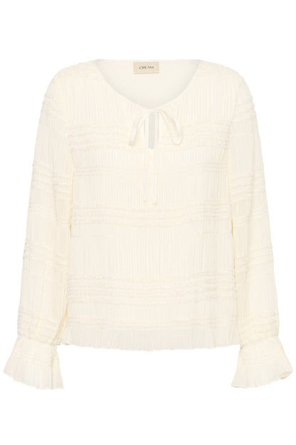 Cream CRSissel textured blouse in Whisper White with tie neckline, layered frill detailing and long ruffle sleeves.