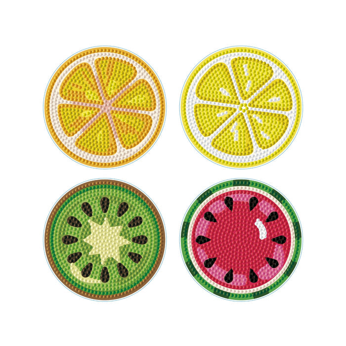 Four round Diamond Dotz Coasters resembling fruit slices—orange, lemon, kiwi, and watermelon—feature detailed seed and rind designs and are arranged in a 2x2 grid on a white background.