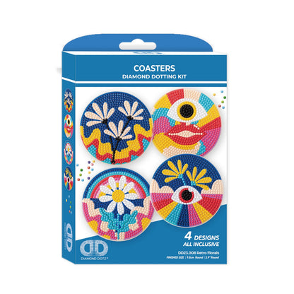 The Diamond Dotz Coasters kit includes four round coasters with colorful abstract floral and geometric designs, packaged in a blue and white box displaying the coasters on the front.