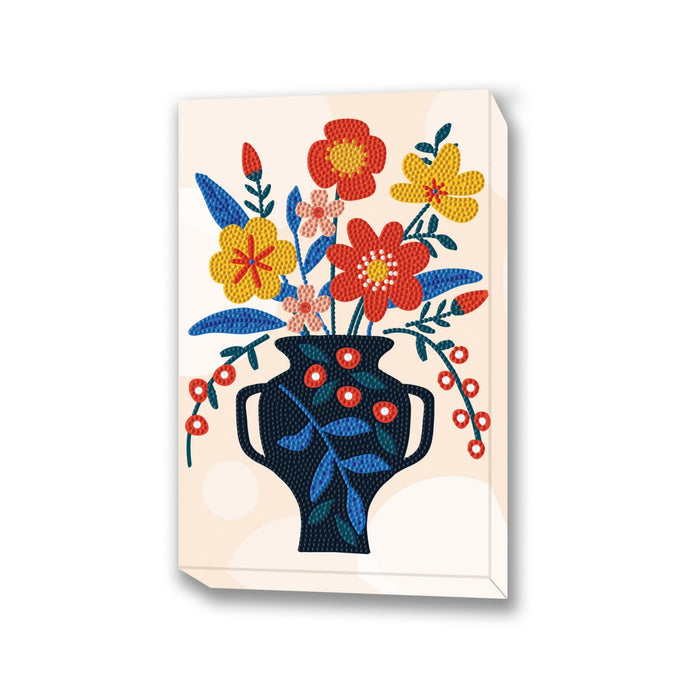 A vibrant Diamond Dotz Large Dotz Decor features red, yellow, and orange flowers with green leaves in a dark blue vase on a light beige background with delicate circular patterns.