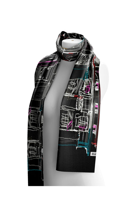 Dotique Dolcezza 76904 assorted woven scarf featuring a black cityscape-inspired artistic print with white, teal, pink and red accents.