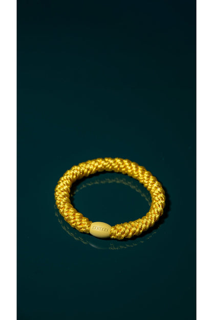 KKNEKKI Sun bright yellow braided elastic hair tie with a matching branded clasp by KKNEKKI. Shop KKNEKKI at Dotique.