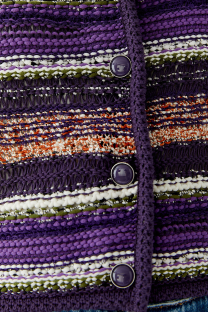 Make a colourful statement with this striking Oui knit cardigan, woven in a special yarn mix that combines rich purple, orange and green stripes with a subtle shimmer of micropaillettes. Cut in a narrow, shortened silhouette, it has a round neckline finished with a neat trim and slim, fitted sleeves for a flattering, considered shape. Valuable metal buttons run down the front for a refined finishing touch.