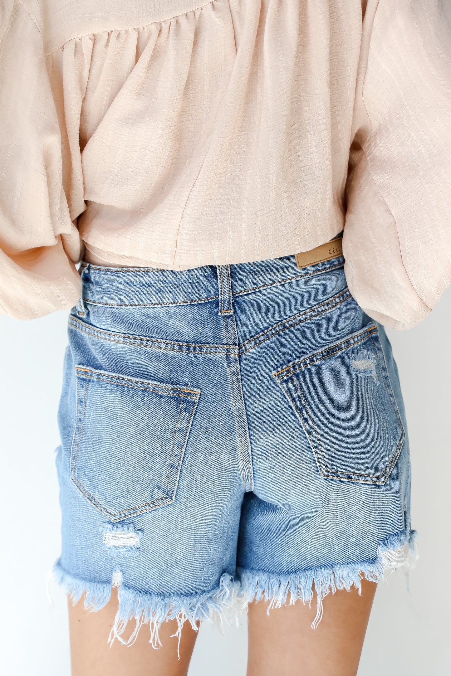 Bottom Line Distressed Denim Shorts