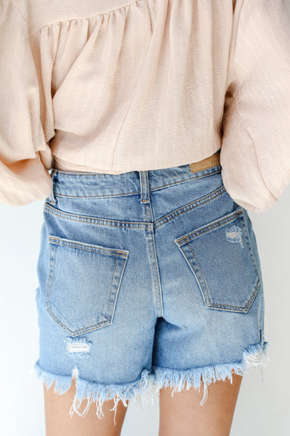 Bottom Line Distressed Denim Shorts
